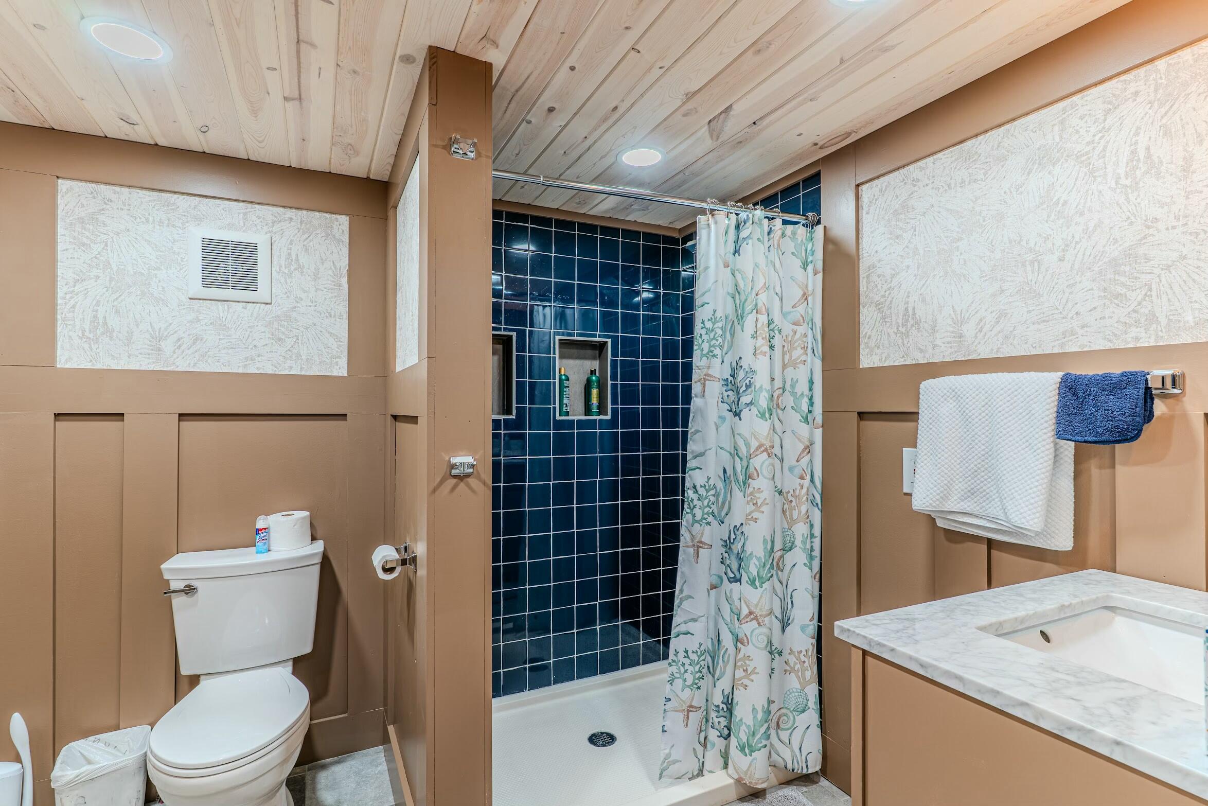 175 Ruth Road Freeport, FL 32439 - Photo 53 of 69 a bathroom with a granite countertop sink a toilet and shower
