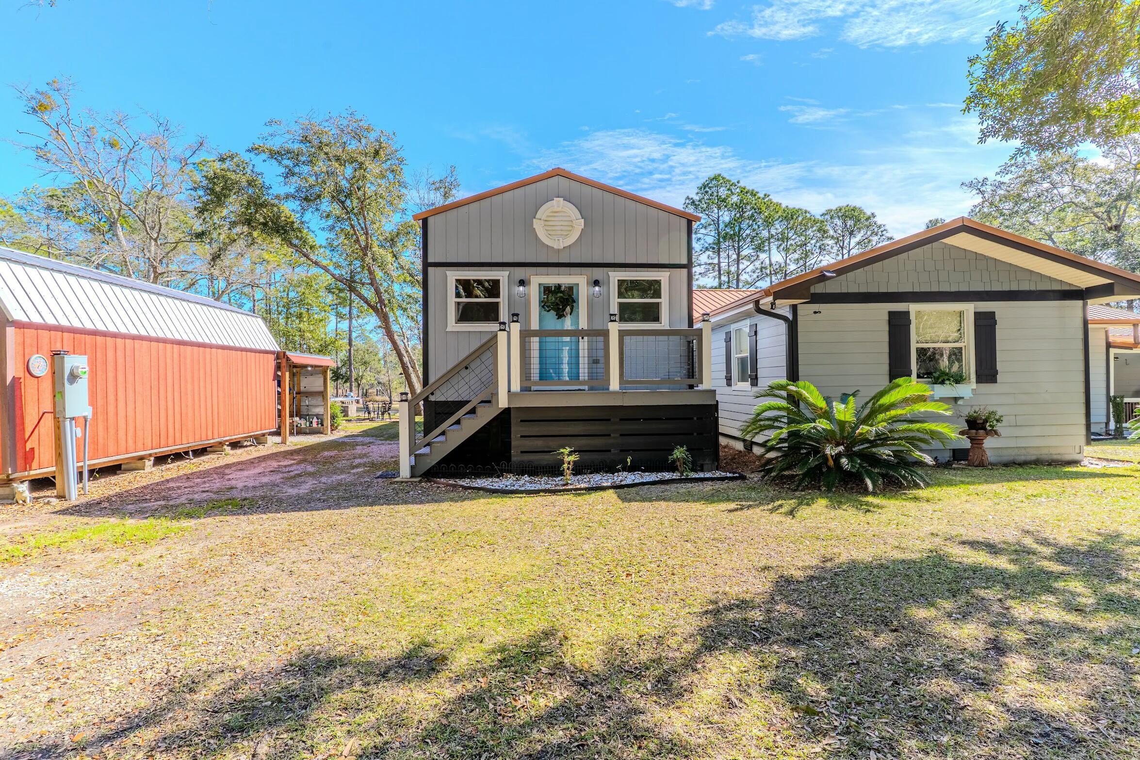 175 Ruth Road Freeport, FL 32439 - Photo 59 of 69 a front view of a house with a yard