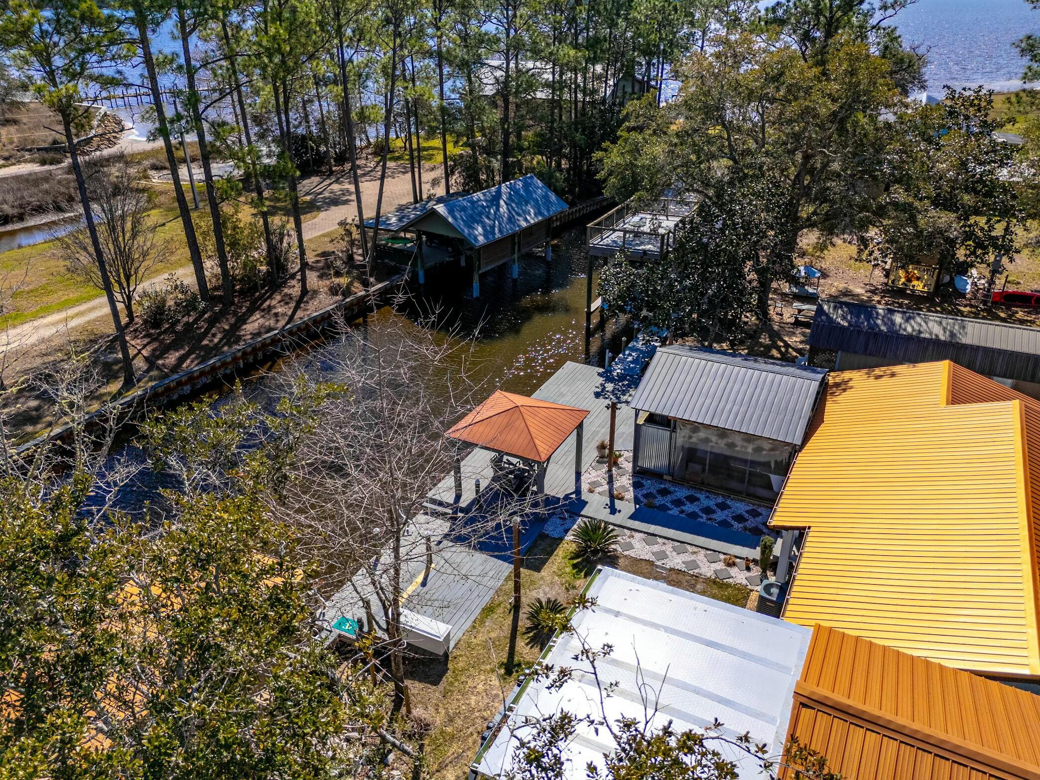 175 Ruth Road Freeport, FL 32439 - Photo 64 of 69 a backyard of a house with table and chairs