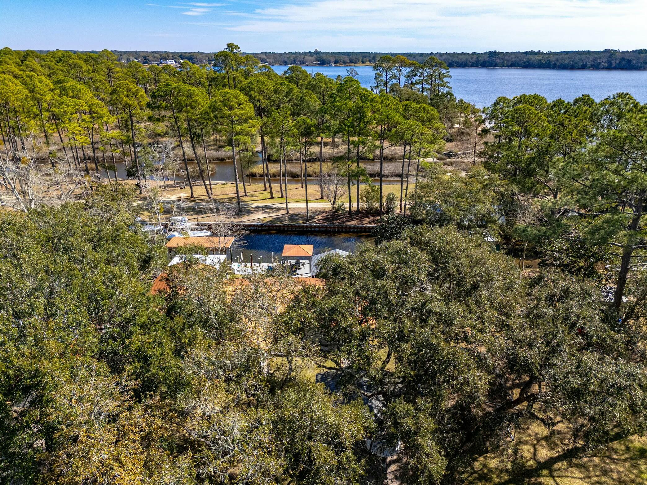 175 Ruth Road Freeport, FL 32439 - Photo 67 of 69 a view of a lake with a building in the background