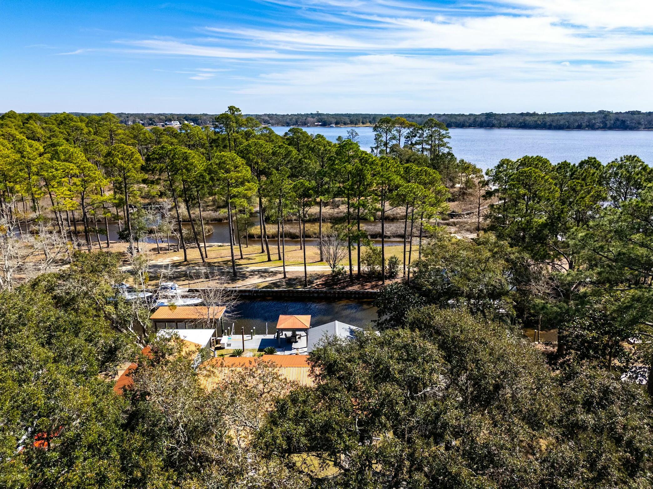 175 Ruth Road Freeport, FL 32439 - Photo 68 of 69 a view of a lake with a nearby beach