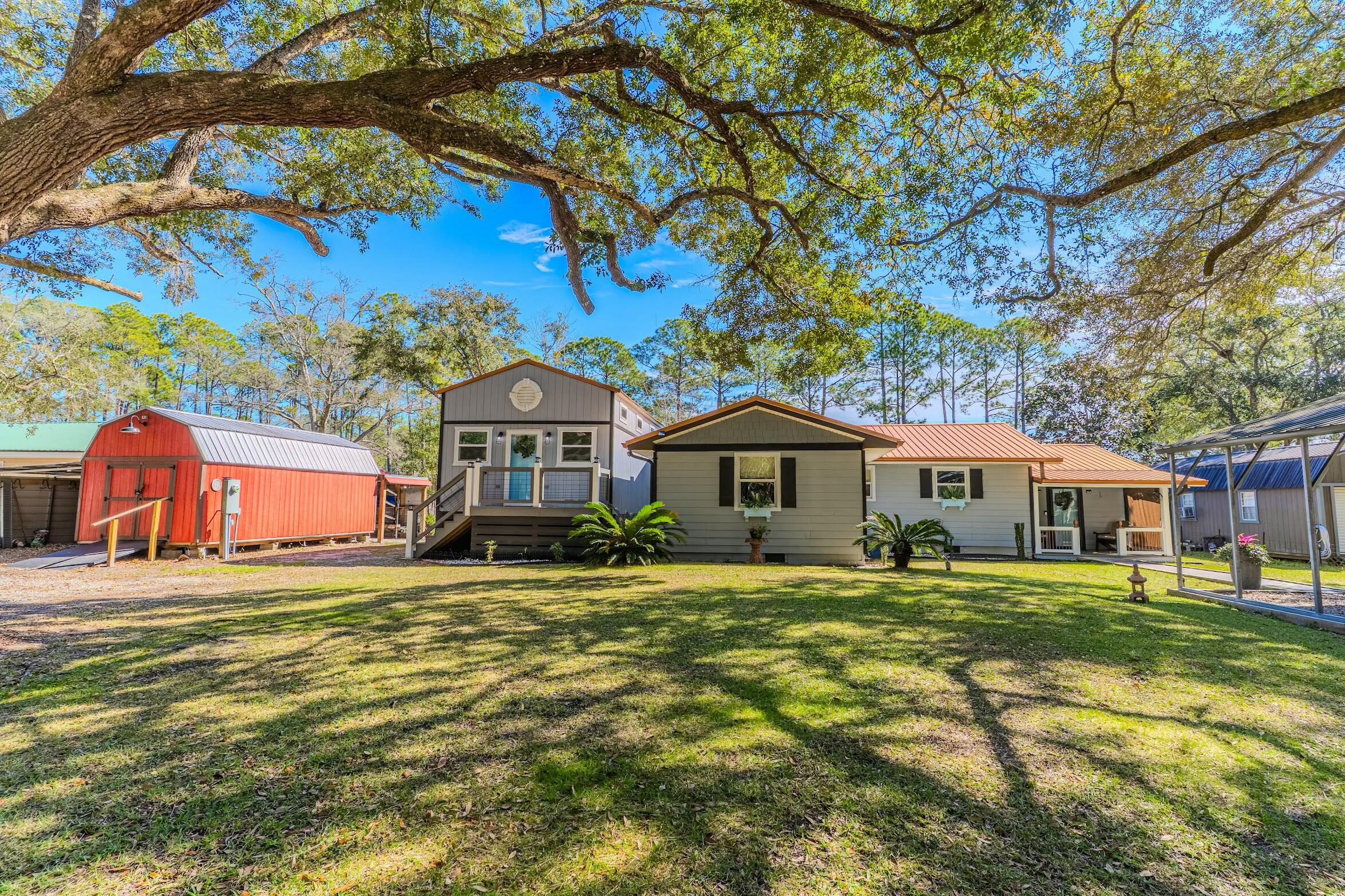 175 Ruth Road Freeport, FL 32439 - Photo 69 of 69 a front view of a house with a yard