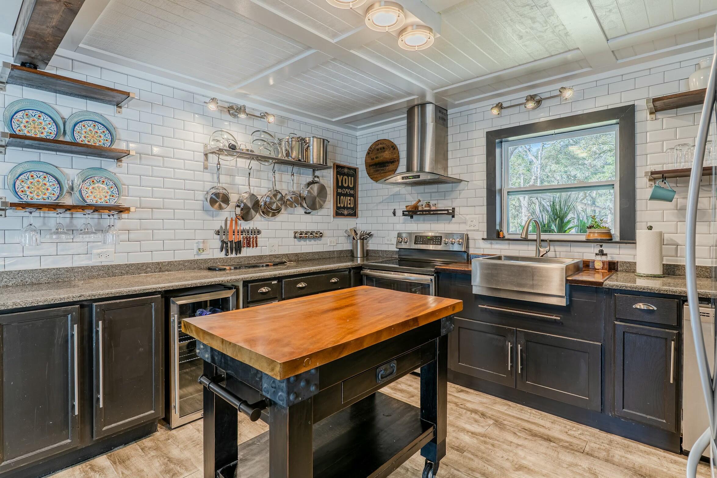175 Ruth Road Freeport, FL 32439 - Photo 9 of 69 a kitchen with stainless steel appliances a stove a sink and a microwave