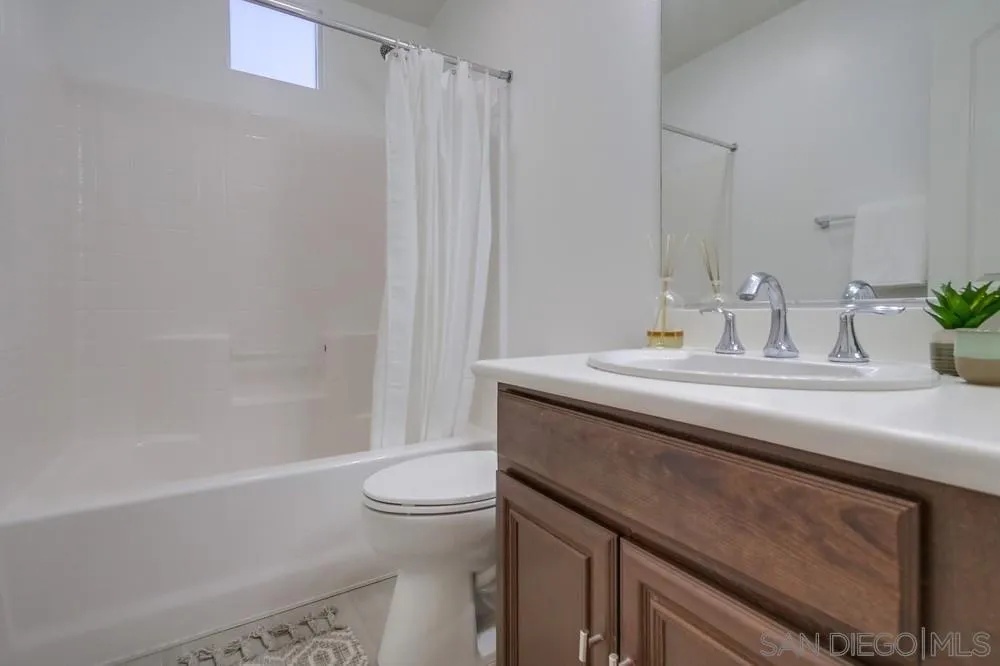 13477 Sydney Rae Place San Diego, CA 92129 - Photo 22 of 73 a bathroom with a sink a toilet and shower