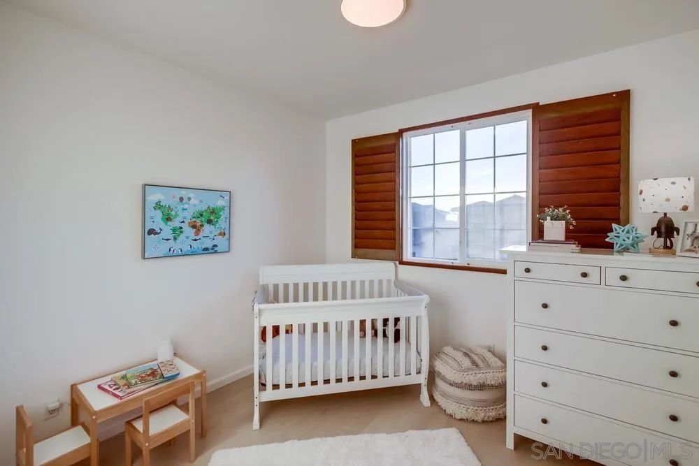 13477 Sydney Rae Place San Diego, CA 92129 - Photo 26 of 73 a bedroom with a bed and a window