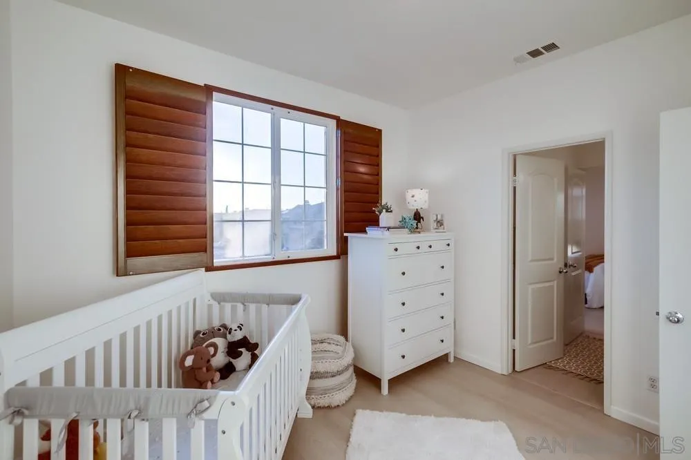 13477 Sydney Rae Place San Diego, CA 92129 - Photo 27 of 73 a bed room with a bed and a window