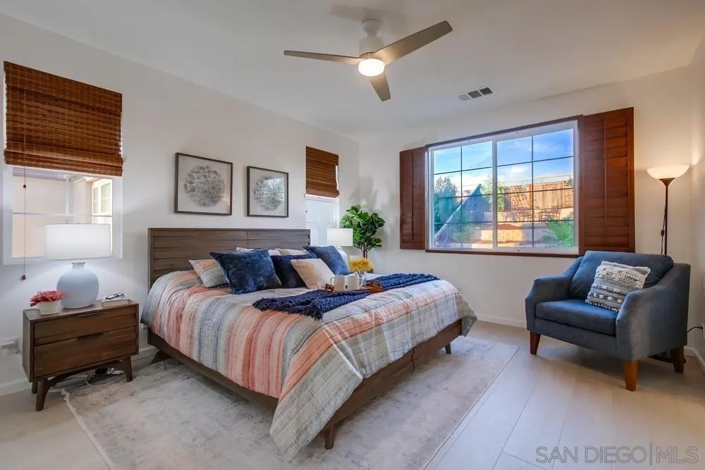 13477 Sydney Rae Place San Diego, CA 92129 - Photo 30 of 73 a bedroom with a bed and a couch
