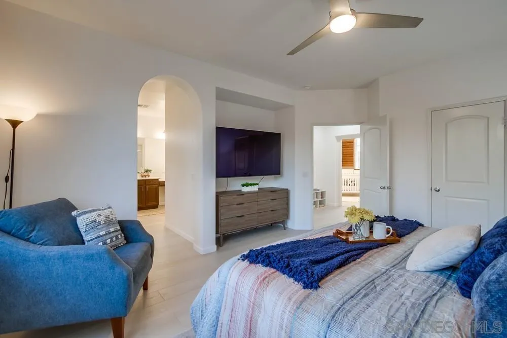 13477 Sydney Rae Place San Diego, CA 92129 - Photo 32 of 73 a bedroom with furniture and a flat screen tv