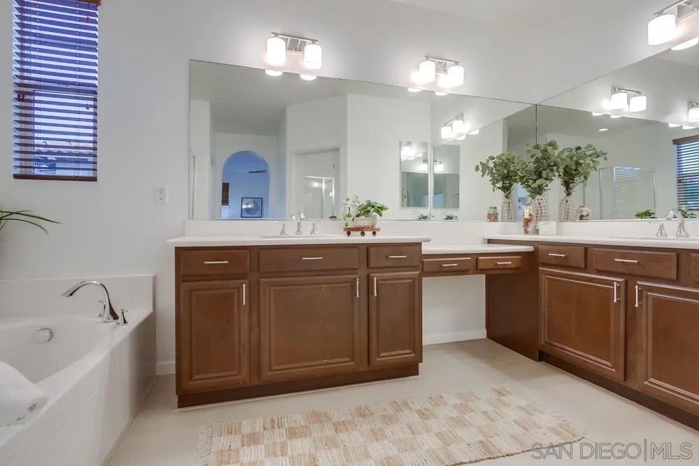 13477 Sydney Rae Place San Diego, CA 92129 - Photo 34 of 73 a kitchen with a sink and a stove