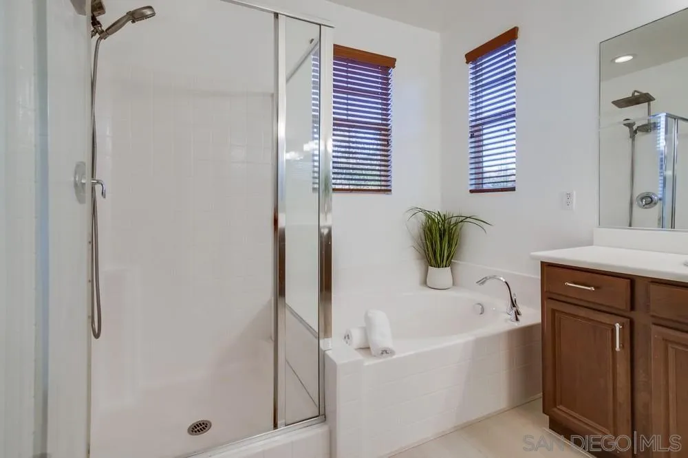 13477 Sydney Rae Place San Diego, CA 92129 - Photo 36 of 73 a white bath tub sitting next to a white sink