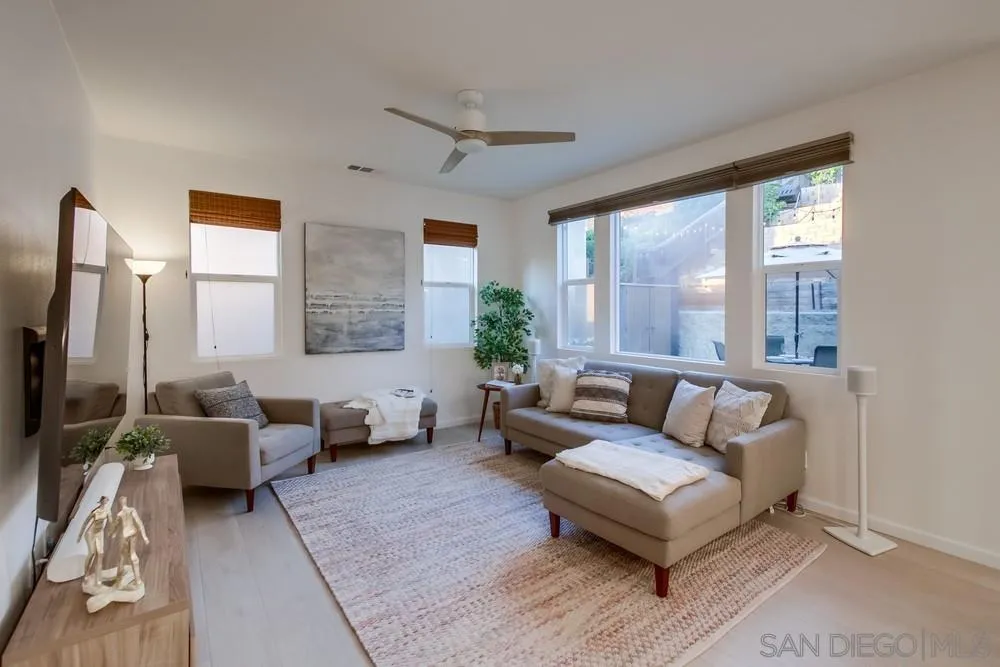 13477 Sydney Rae Place San Diego, CA 92129 - Photo 4 of 73 a living room with furniture and a large window