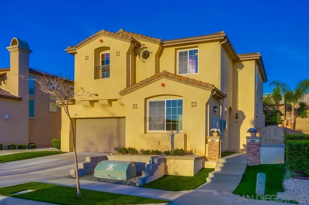 13477 Sydney Rae Place San Diego, CA 92129 - Photo 56 of 73 a front view of a house with a yard