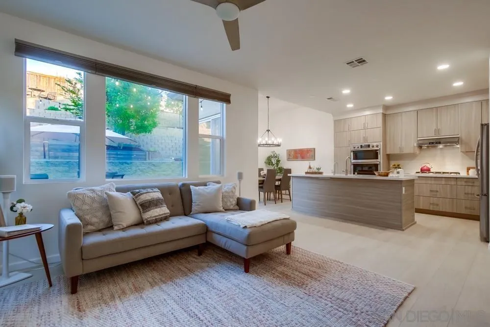 13477 Sydney Rae Place San Diego, CA 92129 - Photo 7 of 73 a living room with furniture and a large window