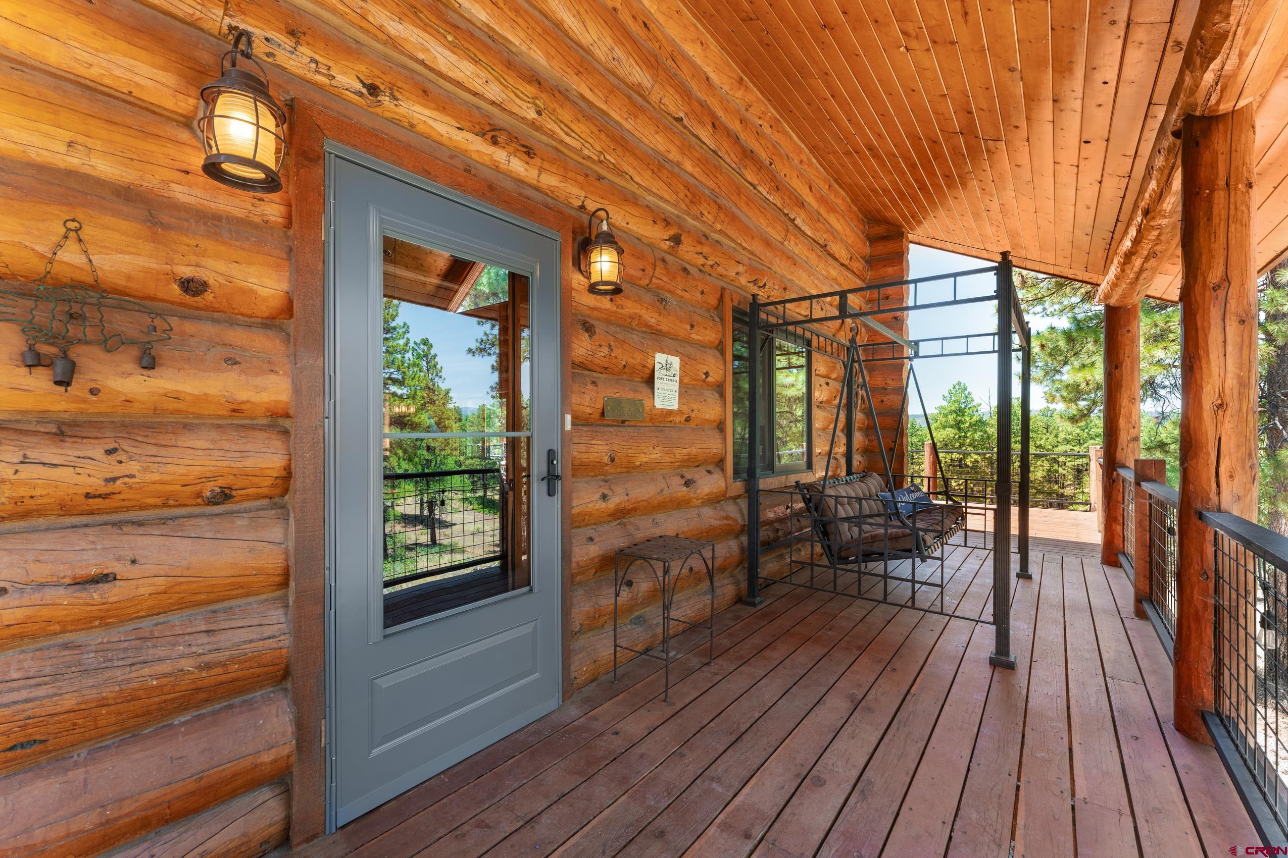 111 South Windy Ridge Drive Bayfield, CO 81122 - Photo 13 of 45 a porch with wooden floor and outdoor space