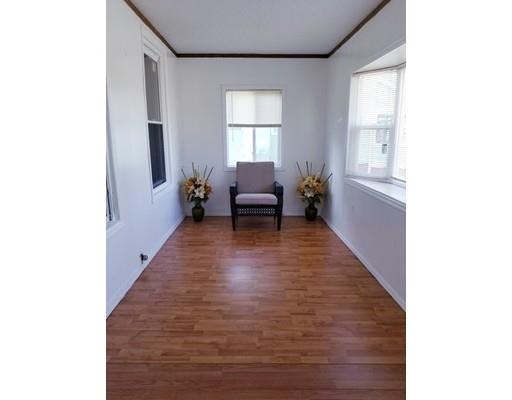 346 Eastern Avenue Springfield, MA 01109 - Photo 4 of 5 a living room with furniture and a large window