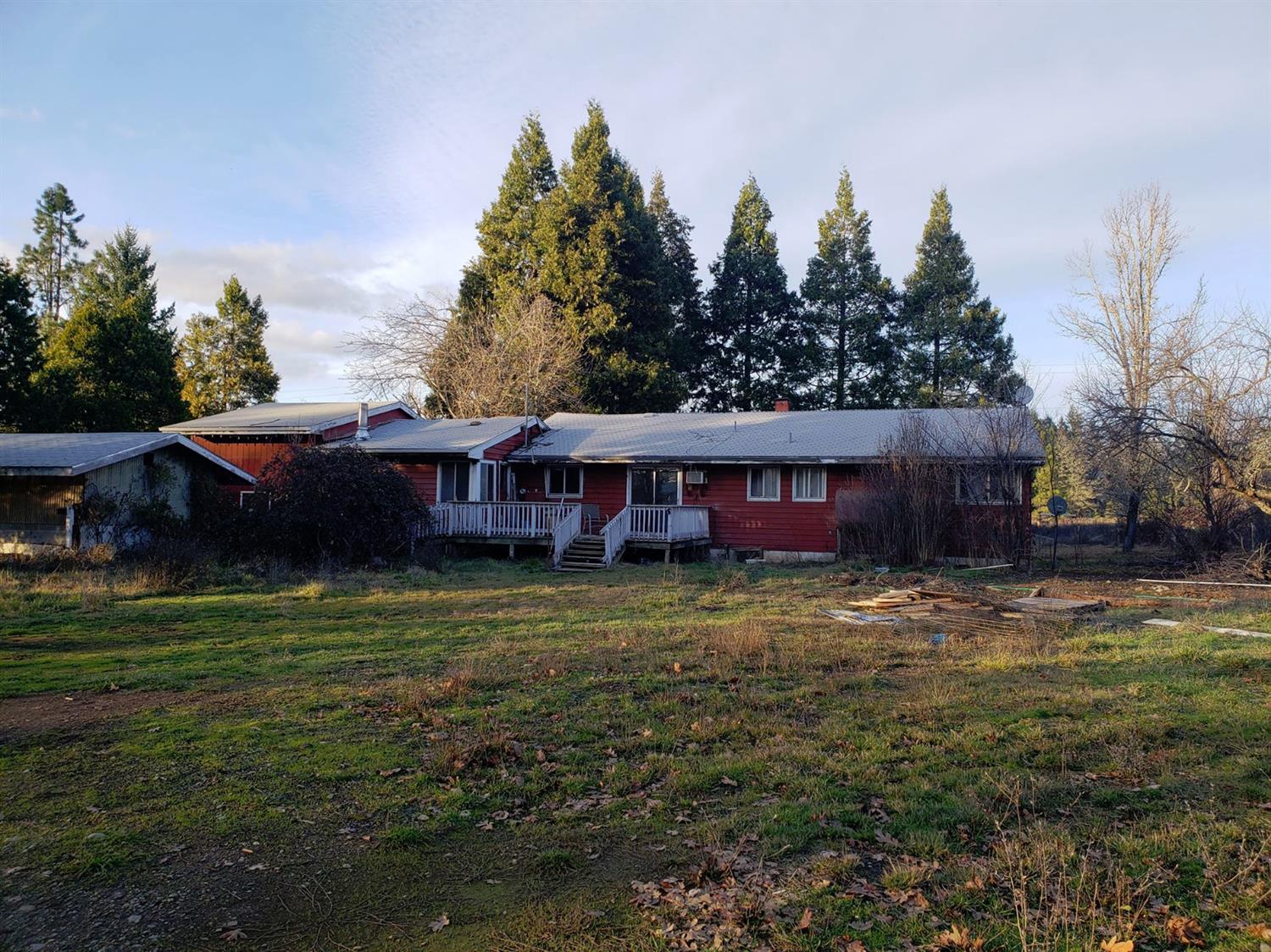 239 Dick George Road Cave Junction, OR 97523 - Photo 1 of 19 a view of a house with a yard