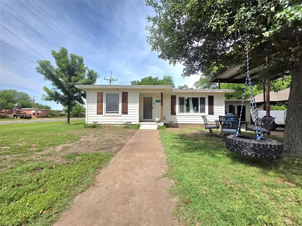 front view of a house with a yard