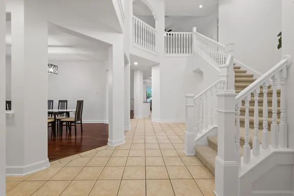 a view of entryway and hall with dining room