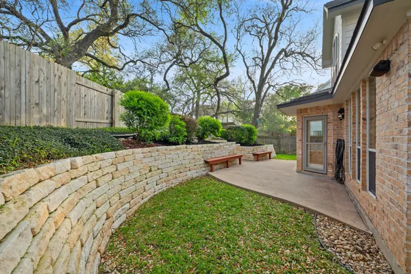 a view of a backyard with a sitting area