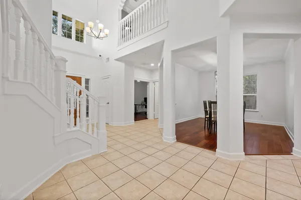 a view of a hallway with closet and bathroom