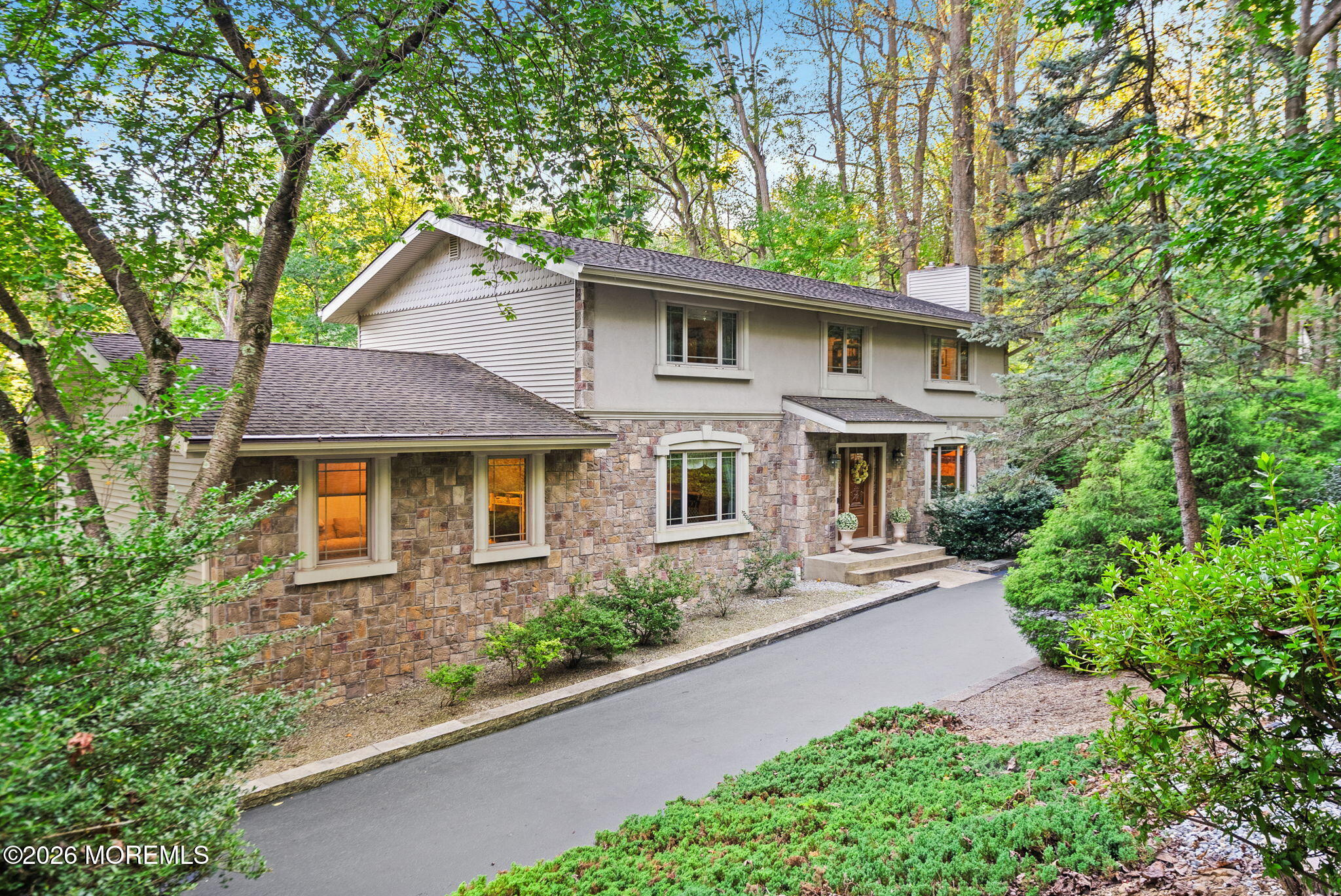 21 Stoney Brook Road Holmdel, NJ 07733 - Photo 1 of 40 a front view of a house with garden