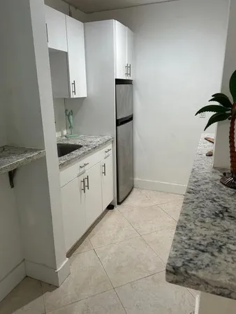 a hallway with potted plant in front of it