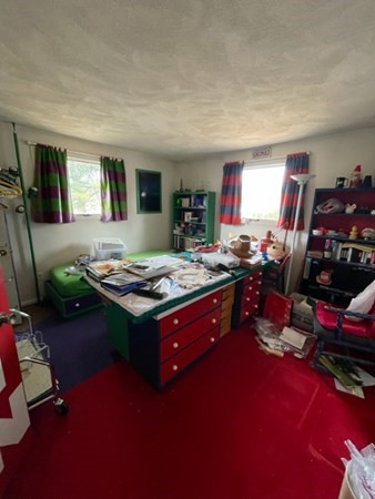 6 Beaver Place Billerica, MA 01821 - Photo 16 of 25 a room with furniture and a flat screen tv