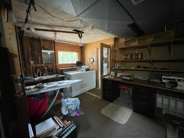 6 Beaver Place Billerica, MA 01821 - Photo 22 of 25 a kitchen with a sink stove and cabinets