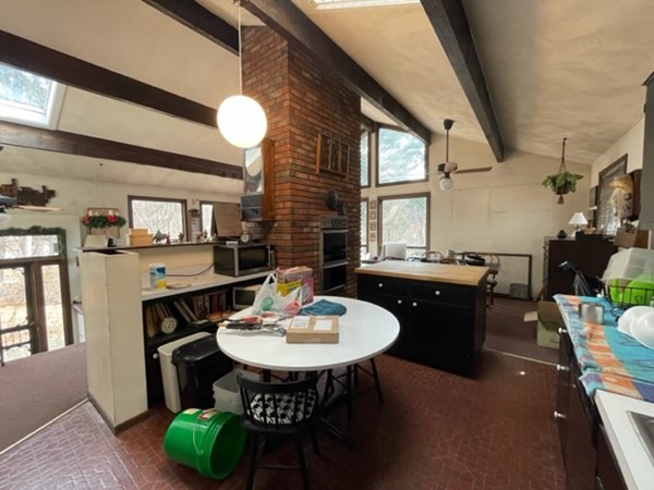 6 Beaver Place Billerica, MA 01821 - Photo 10 of 25 a dining room with furniture a rug and wooden floor