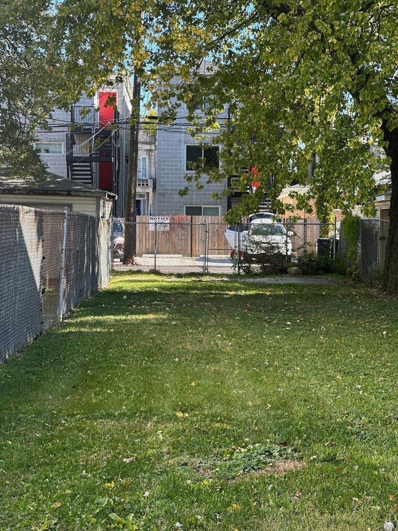 1235 South California Avenue Chicago, IL 60608 - Photo 2 of 4 a view of a house with a backyard porch and sitting area