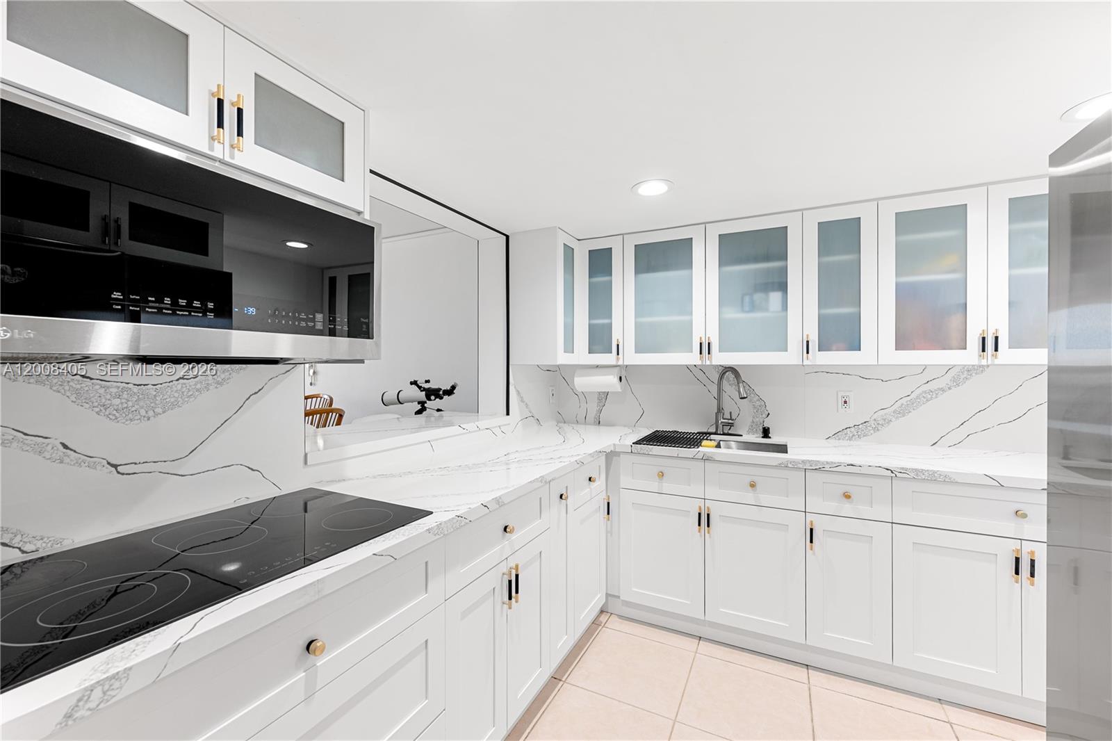 6195 Rock Island Road, Unit 503 Tamarac, FL 33319 - Photo 1 of 29 a kitchen with a sink and cabinets