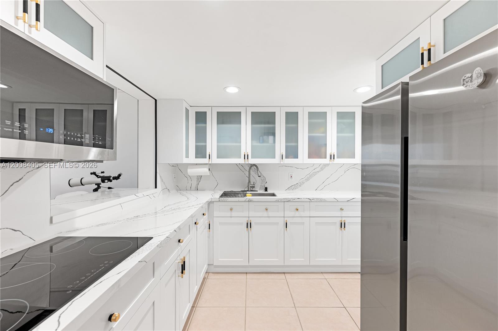 6195 Rock Island Road, Unit 503 Tamarac, FL 33319 - Photo 2 of 29 a view of a kitchen with a sink and cabinets