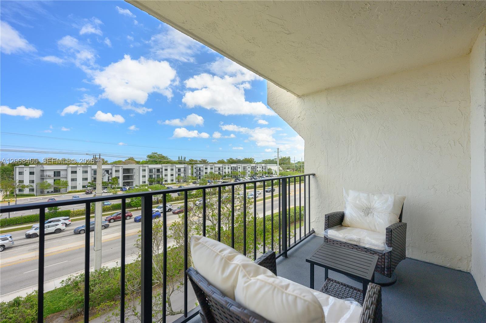 6195 Rock Island Road, Unit 503 Tamarac, FL 33319 - Photo 22 of 29 a view of a balcony with furniture