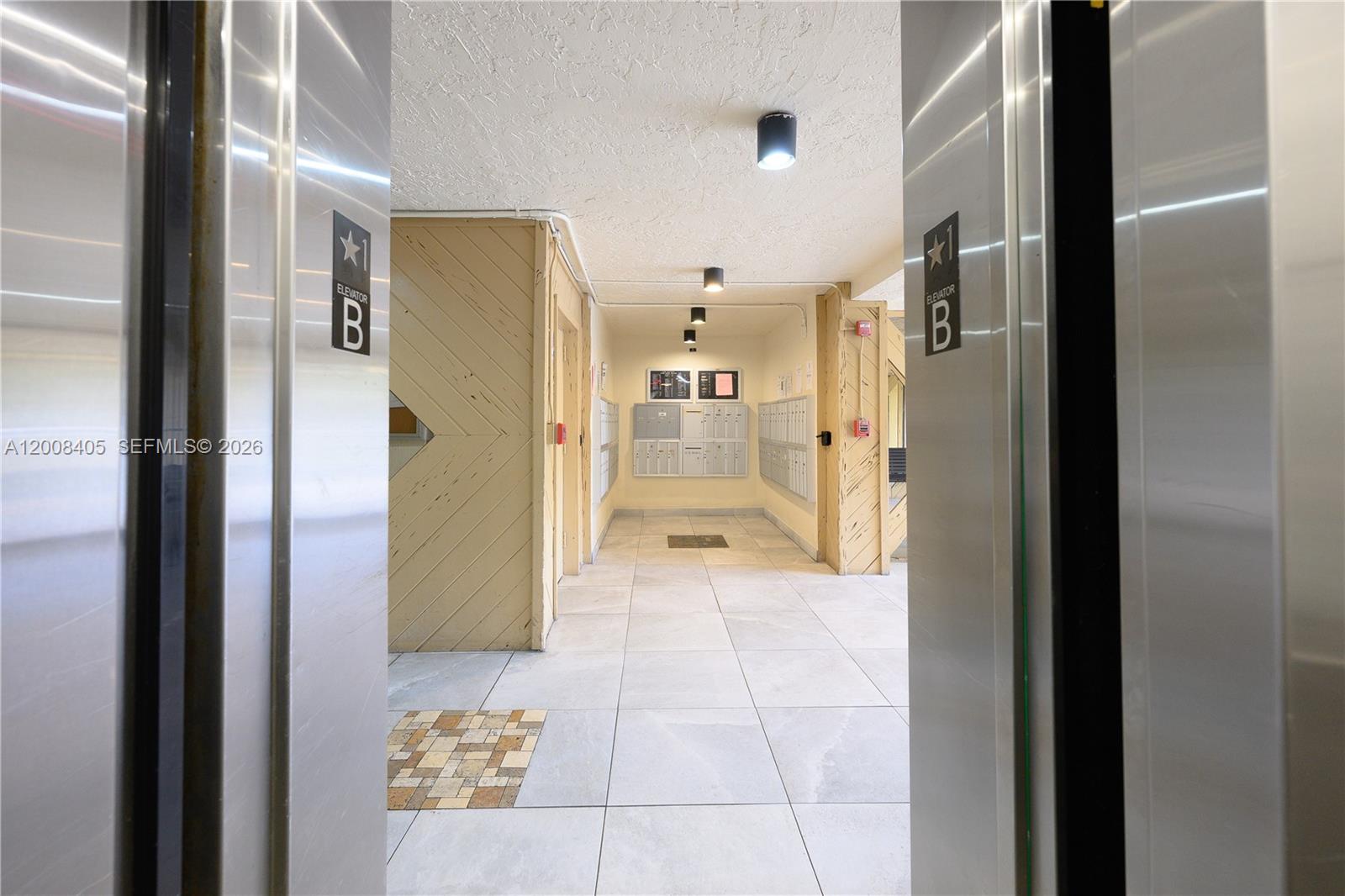 6195 Rock Island Road, Unit 503 Tamarac, FL 33319 - Photo 25 of 29 a bathroom with a glass shower door and a glass door