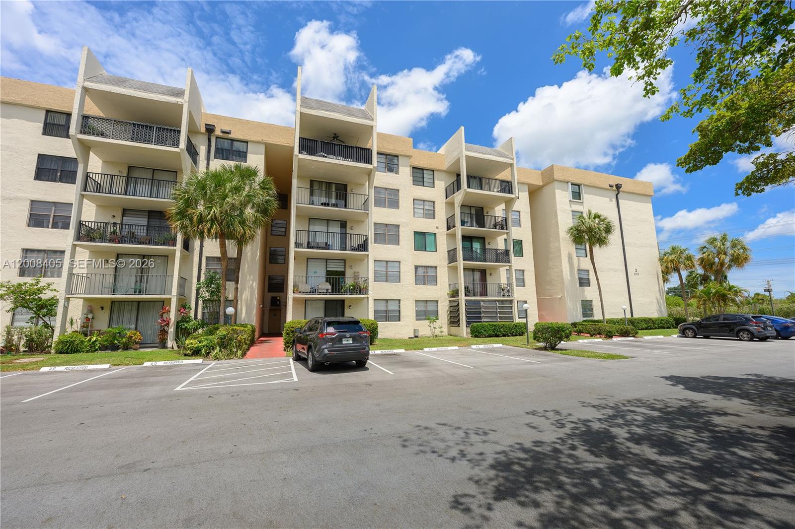6195 Rock Island Road, Unit 503 Tamarac, FL 33319 - Photo 27 of 29 a view of a building with a street