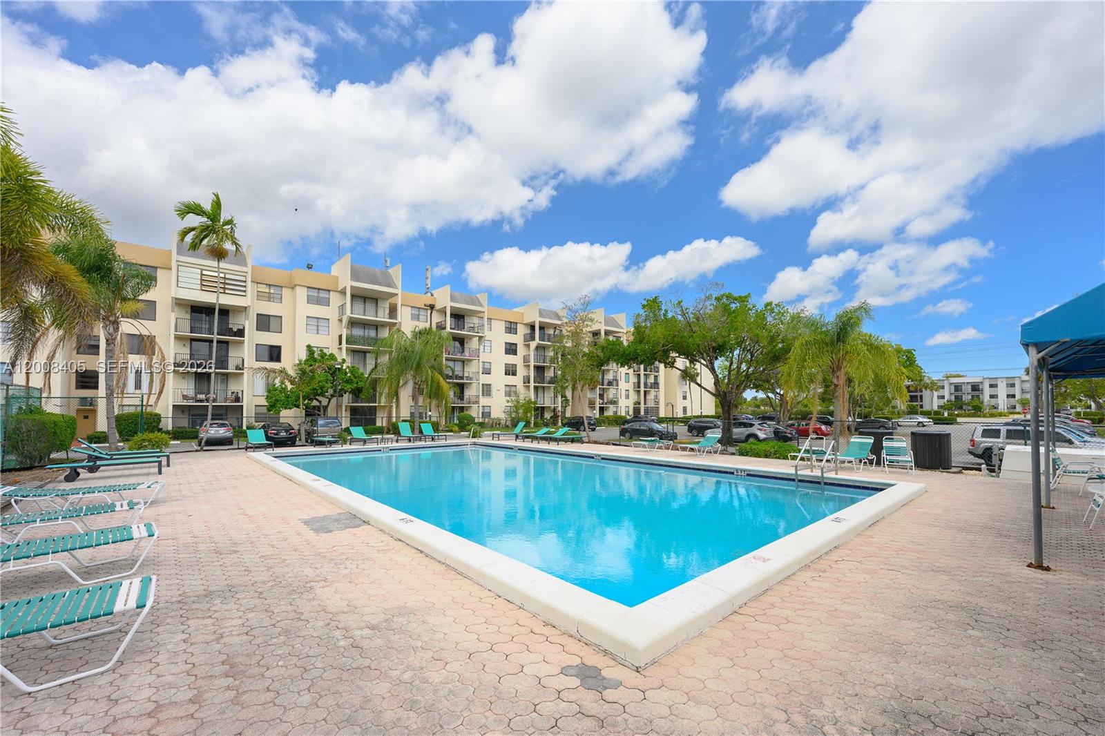 6195 Rock Island Road, Unit 503 Tamarac, FL 33319 - Photo 29 of 29 a view of a swimming pool and a terrace