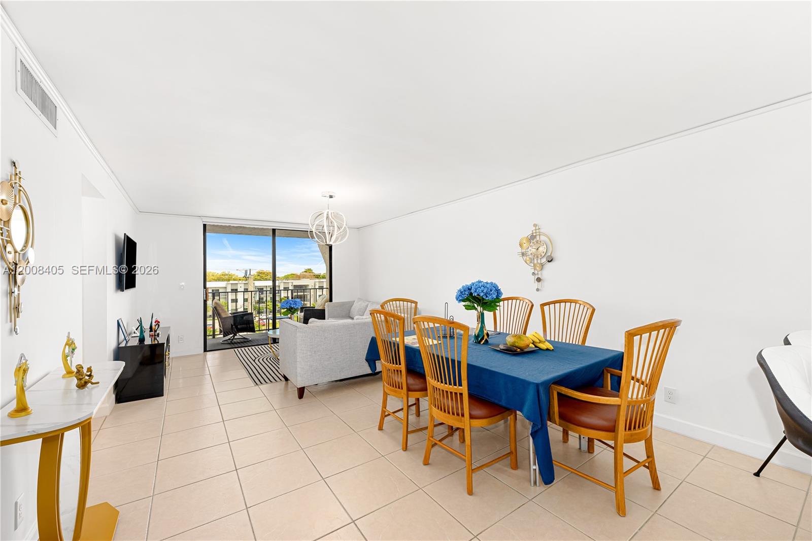6195 Rock Island Road, Unit 503 Tamarac, FL 33319 - Photo 8 of 29 a dining room with furniture and wooden floor
