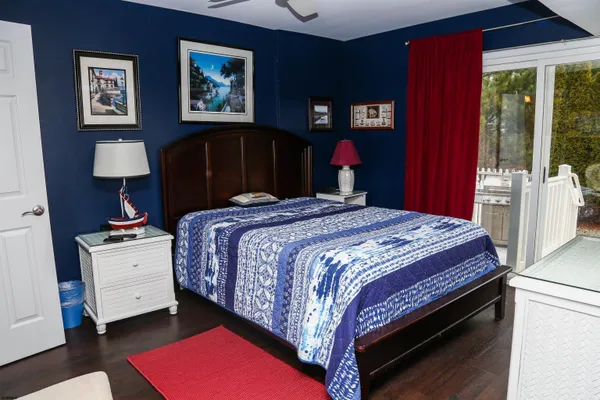 a bedroom with bed and a window