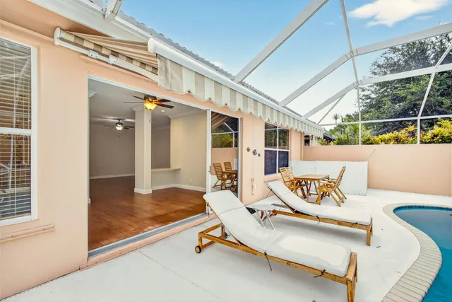 a outdoor space with patio the couches and a dining table with the view of the house