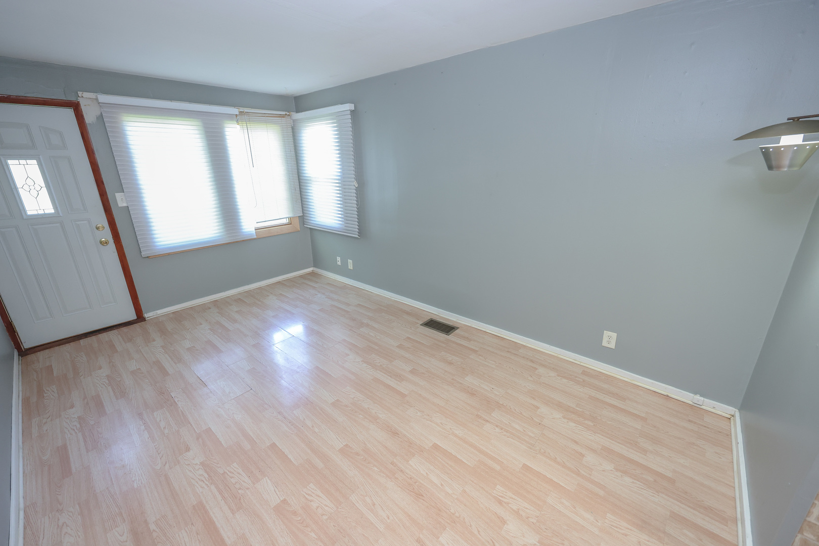 200 South Park Road Joliet, IL 60433 - Photo 3 of 11 wooden floor in an empty room with a window