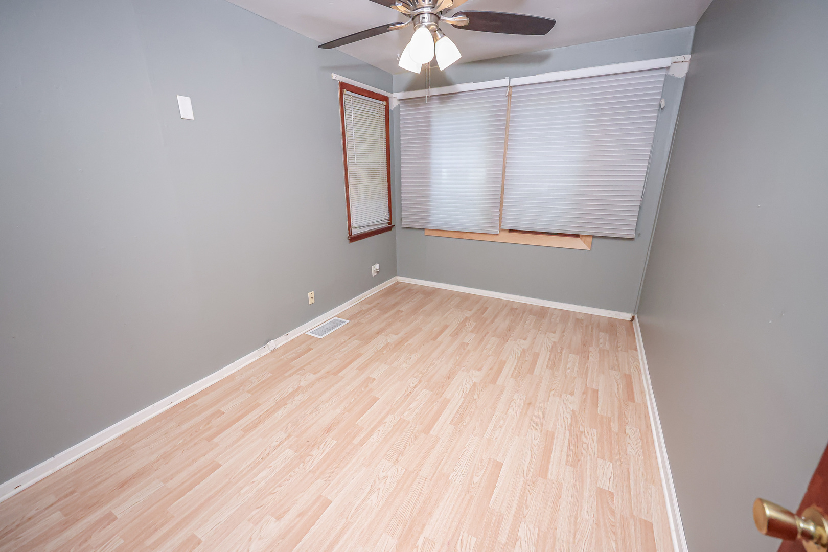 200 South Park Road Joliet, IL 60433 - Photo 6 of 11 wooden floor in an empty room with a window