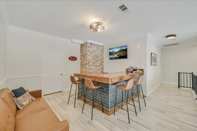 a view of a livingroom with furniture and a flat screen tv