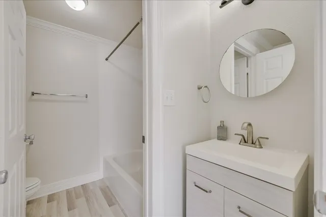 a bathroom with a sink and mirror