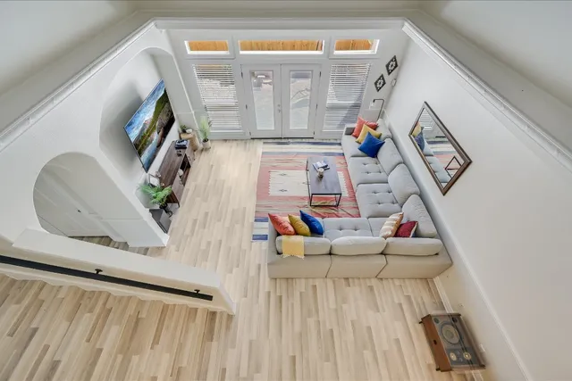 a living room with furniture and a flat screen tv