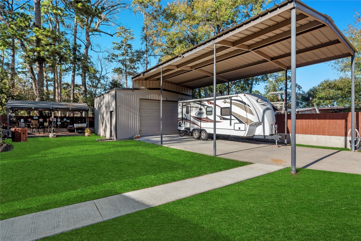 1203 Lemm Road 2 Spring, TX 77373 - Photo 19 of 21 This versatile property includes a detached workshop and a massive three-car carport designed for high-profile RV or boat storage.