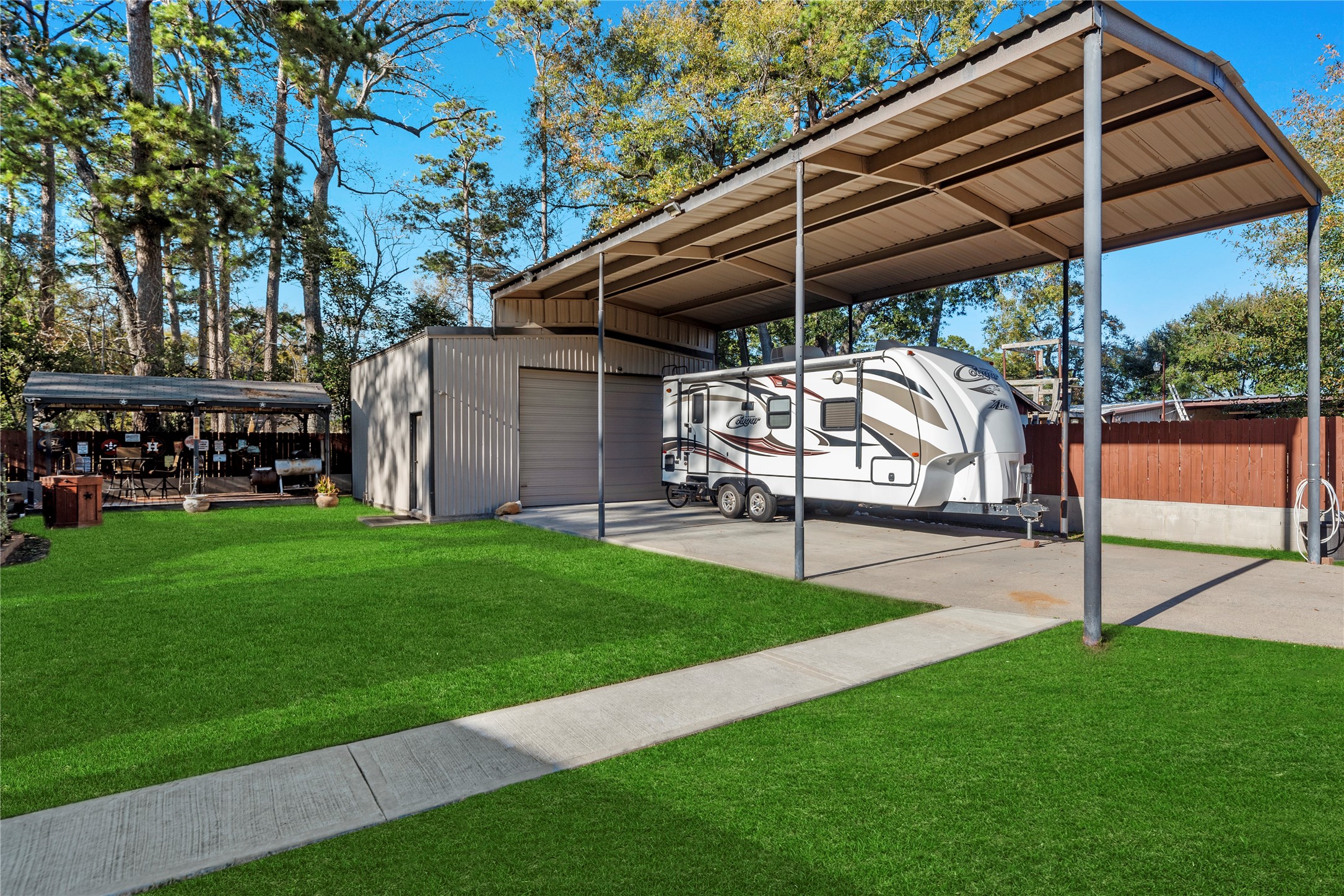 1203 Lemm Road 2 Spring, TX 77373 - Photo 19 of 21 This versatile property includes a detached workshop and a massive three-car carport designed for high-profile RV or boat storage.