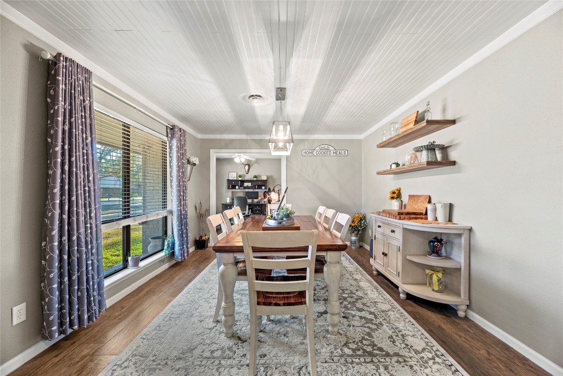 1203 Lemm Road 2 Spring, TX 77373 - Photo 6 of 21 Host memorable dinners under a shiplap-style ceiling in this formal dining space, accented by floating wood shelves and a rustic chandelier.