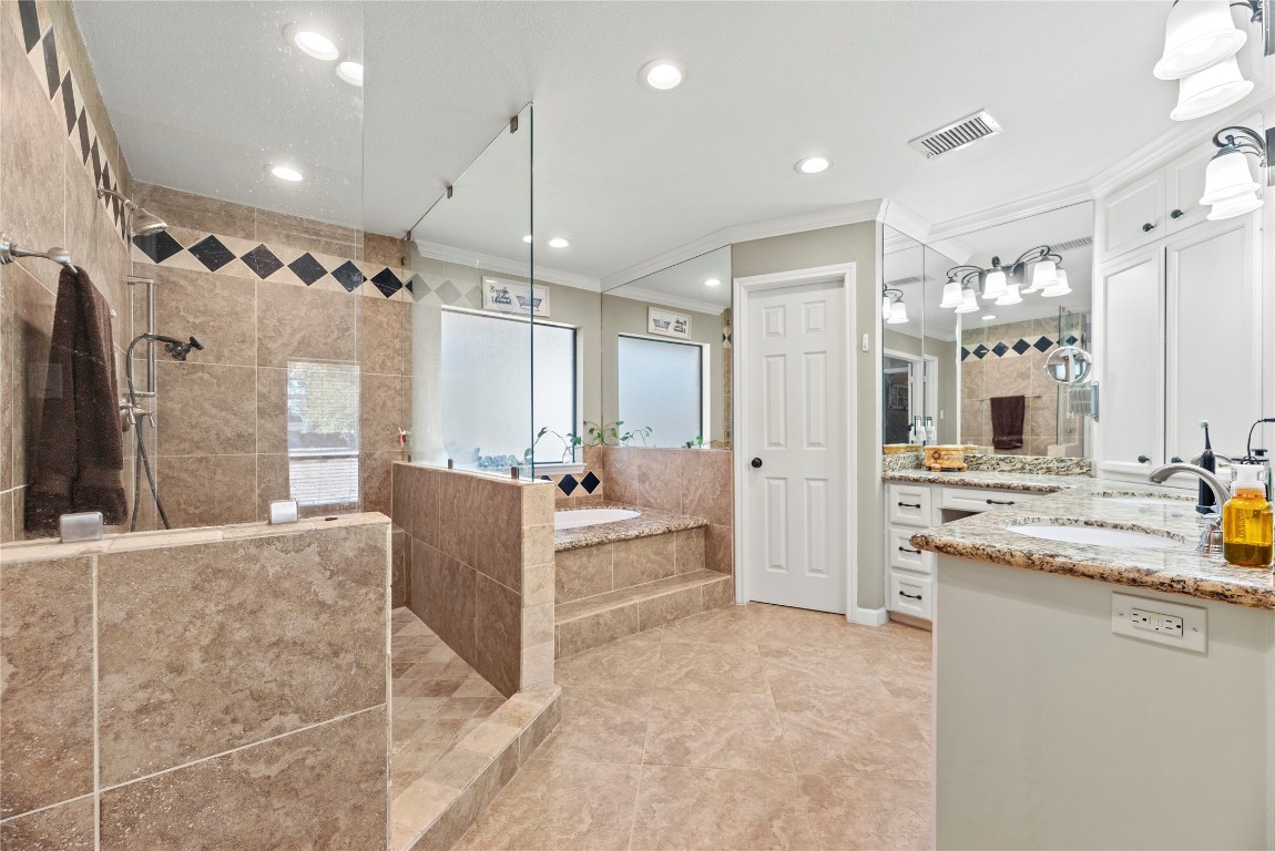 1203 Lemm Road 2 Spring, TX 77373 - Photo 10 of 21 Indulge in the spa-like primary bath complete with a jetted soaking tub, separate shower, and double sinks on an L-shaped vanity.
