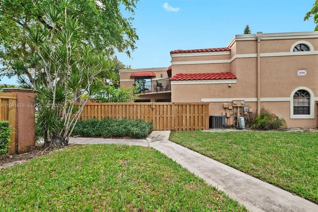 a view of a back yard of a house