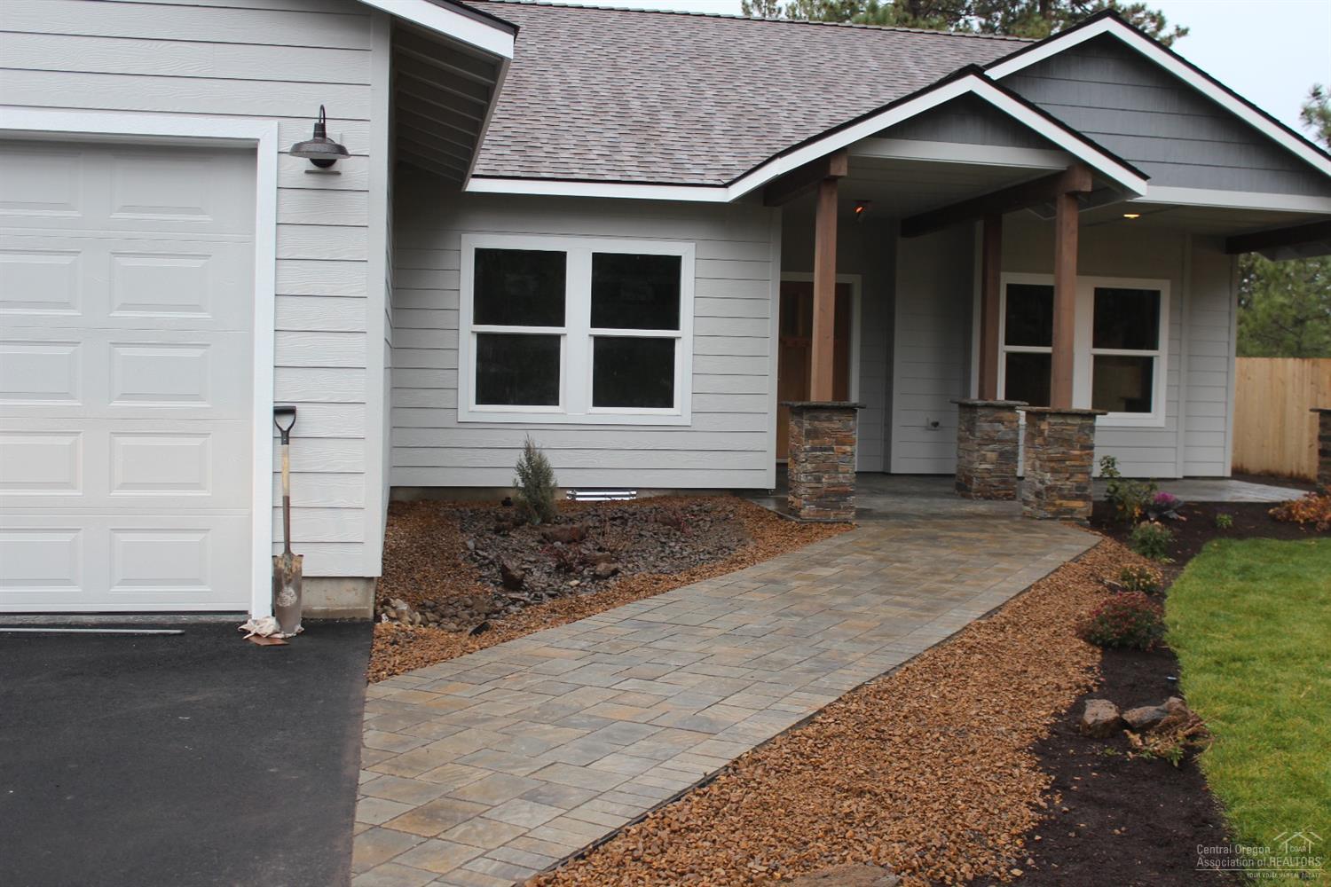 60395 Cinder Butte Road Bend, OR 97702 - Photo 3 of 20 a front view of a house with a yard